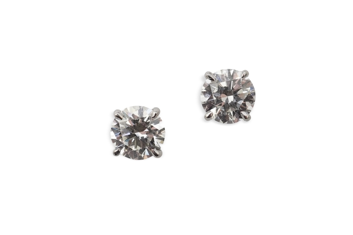 A pair of diamond stud earrings